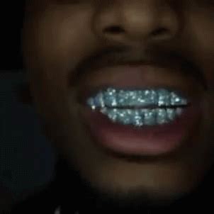 rappers with diamond teeth gif